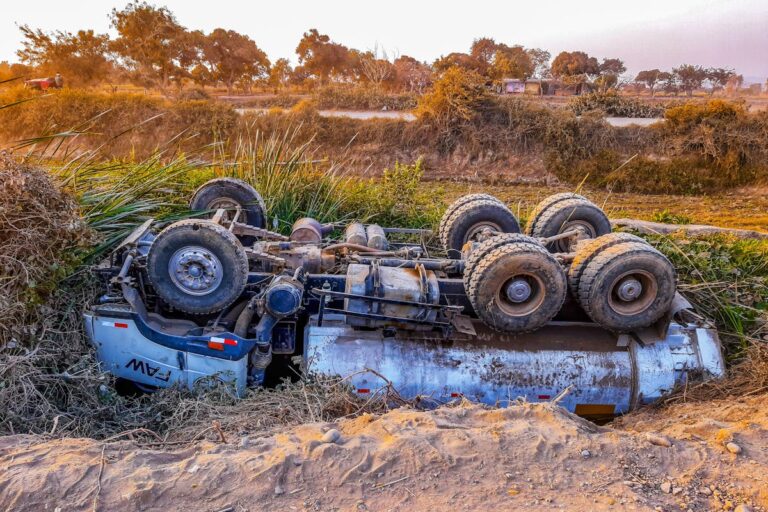 Wrecked Truck Upside Down On Roadside